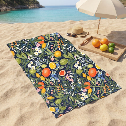 Magical Fruitiness beach towel, displayed in a summer setting.