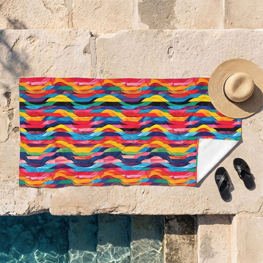Retro Ripples beach towel, displayed in a summer setting.