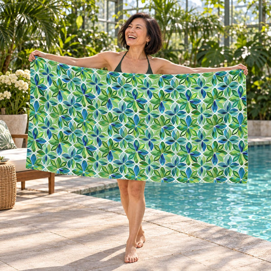 Spring Geo Flowers beach towel, shown with an adult in a summer setting.