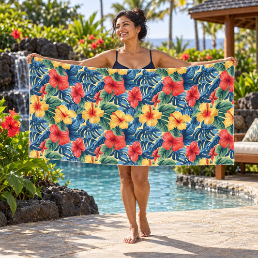 Hawaiian Hibiscus Bliss beach towel, shown with an adult in a summer setting.