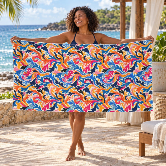 Colorful Mod Coral beach towel, shown with an adult in a summer setting.