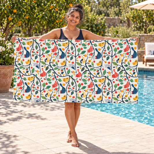 Catbird Tree beach towel, shown with an adult in a summer setting.