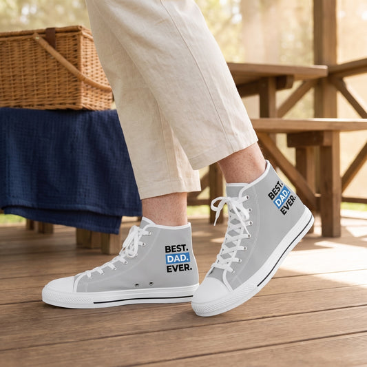 Best Dad Ever! Men's High Top Sneakers. Lifestyle scene: Father's day family picnic pavilion; clean timber floor, simple bench, picnic basket and folded navy blanket behind