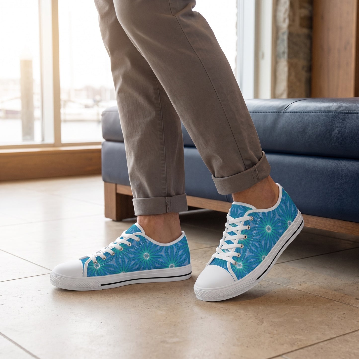 Sapphire Nebula Men's Low Top Sneakers. Lifestyle scene: Waterfront boutique lobby; limestone floor, navy leather bench, large harbour windows