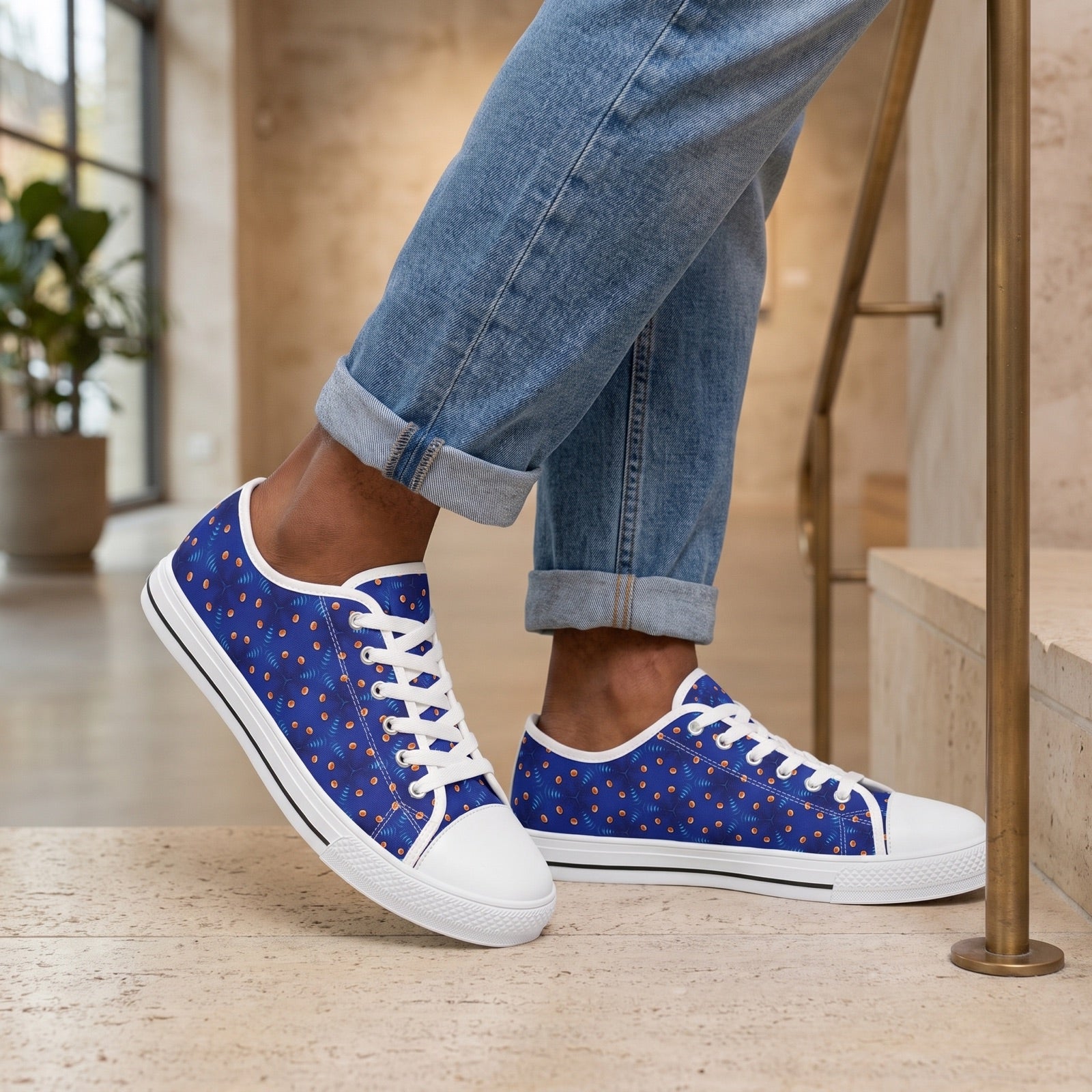 GeoSpark Men's Low Top Sneakers. Lifestyle scene: Urban gallery stair landing; dry pale stone, brushed bronze handrail, clean daylight