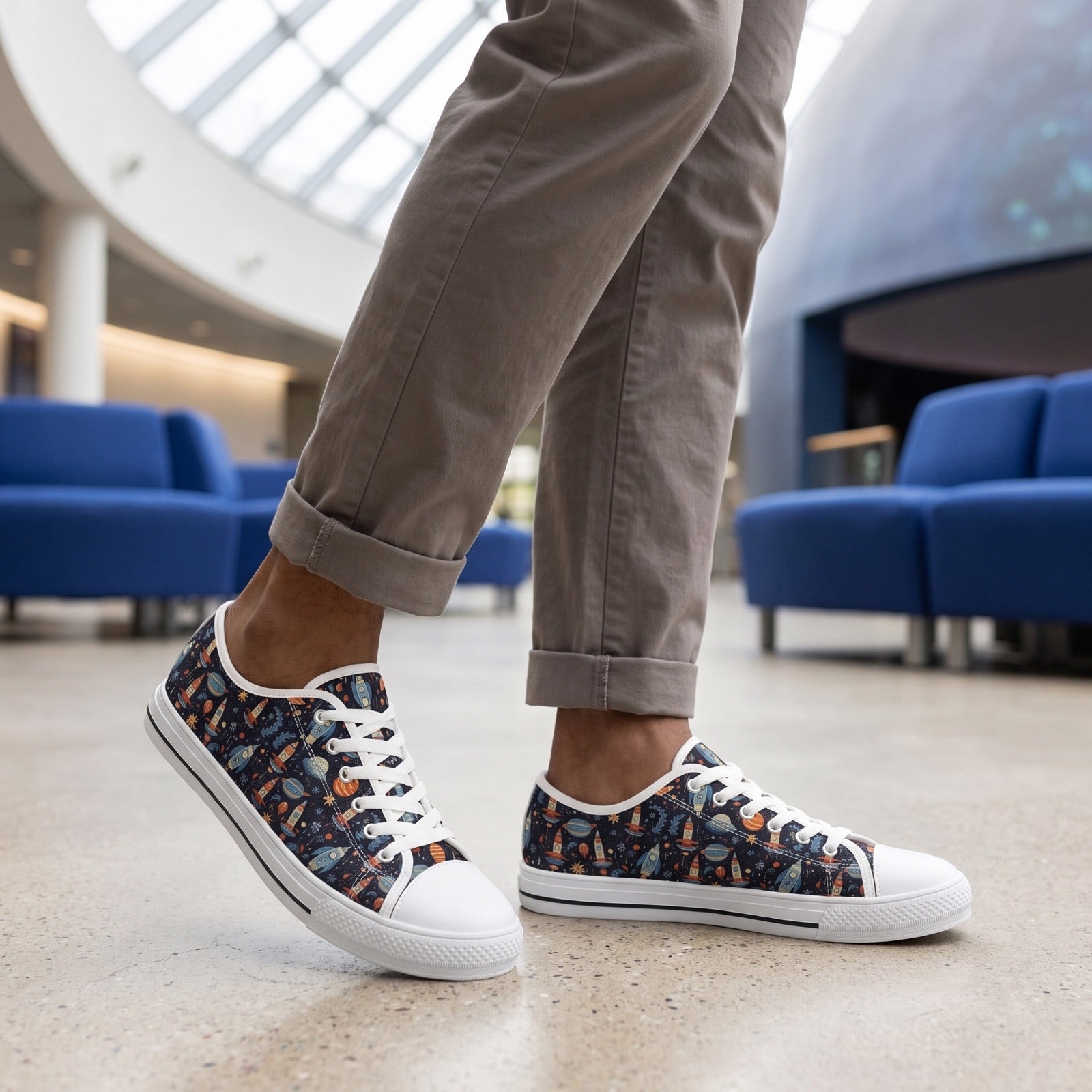 Galactic Space Rocket Romp Men's Low Top Sneakers — Indoor planetarium atrium; light concrete, cobalt seating accent, diffused skylight