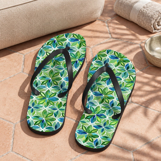Spring Geo Flowers Flip Flops. Lifestyle scene: Geometric garden pool pavilion; dry pale hexagon tiles, cream chair, green shadow patterns