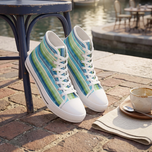 Ocean Whisper Stripes Ladies' High Top Sneakers. Lifestyle scene: Canal-side café at midday; warm brick paving, navy bistro chair, soft water reflections