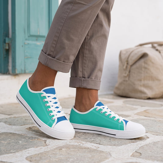 Turquoise Reef Ladies' Two-Tone Low Top Sneakers — Greek island guesthouse landing; pale irregular stone, turquoise shutter, linen travel bag far behind