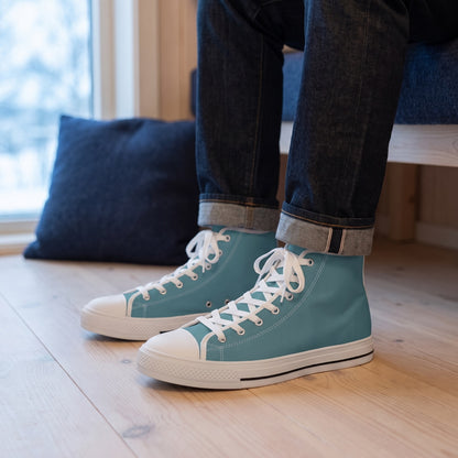 Arctic Ocean Men's Two-Tone High Top Sneakers. Lifestyle scene: Nordic harbour guesthouse; pale timber floor, navy wool cushion behind, cool window glow