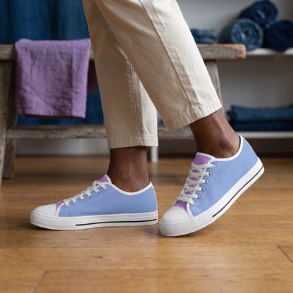 Purple Daze Ladies' Two-Tone Low Top Sneakers. Lifestyle scene: Indigo-dyed textile studio; warm oak floor, violet linen swatch folded on bench, soft north light