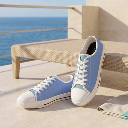 Turquoise Breeze Men's Two-Tone Low Top Sneakers — Modern seaside hotel balcony; pale limestone, sand-coloured chair, sea blue background