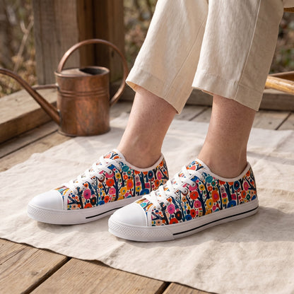 Poppy Forest Ladies' Low Top Sneakers — Flower-farm picnic shelter; worn wood boards, plain linen blanket, copper watering can in background