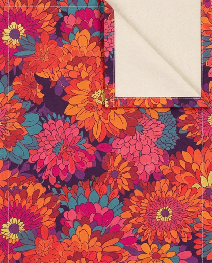 On Fire Flower Power table runner close-up — cotton twill front with natural cotton reverse and hemmed edge