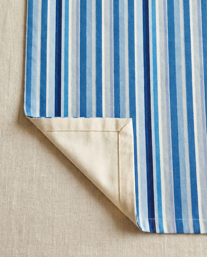Shades of Light Blue Stripes table runner close-up — cotton twill front with natural cotton reverse and hemmed edge