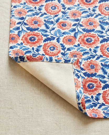 Whimsical Batik Blossoms table runner close-up — cotton twill front with natural cotton reverse and hemmed edge