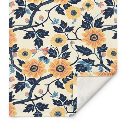 Close-up of Golden Vine Tapestry cotton twill table runner showing the printed face, hemmed edge, white seam thread, and natural-white unprinted reverse