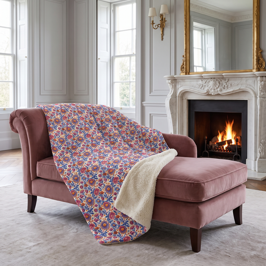 Regal Blossom sherpa fleece blanket on a dusty-rose chaise in a stately drawing room
