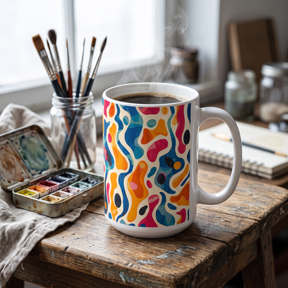 Oceanic Color Splash ceramic mug on an art studio taboret with watercolor tins and brushes