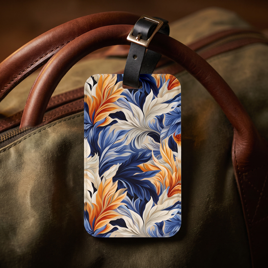 Feathered Fresco Fusion acrylic luggage tag at true size on an olive waxed-canvas holdall