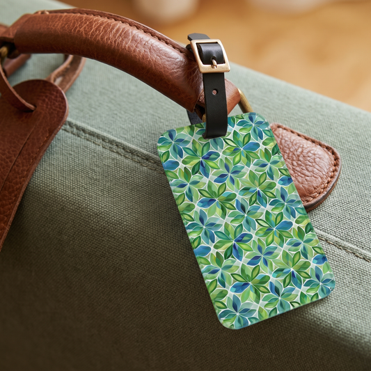 Spring Geo Flowers acrylic luggage tag at true size on a sage-green canvas suitcase