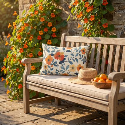 Amber Breeze lumbar outdoor pillow styled in a sunlit outdoor setting