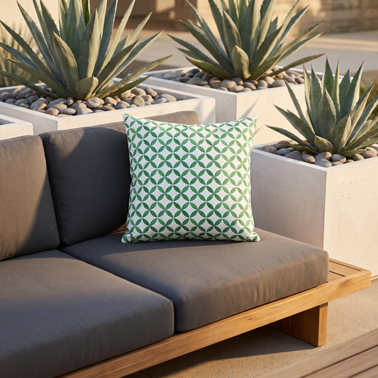 Coin Toss Chic square outdoor pillow styled in a sunlit outdoor setting