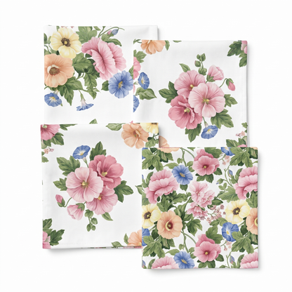 Four folded 10-inch Pastel Garden Elegance cocktail napkins arranged in a two-by-two flat lay