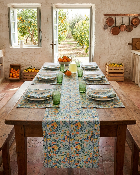 Modern Citrus Tree table runner styled straight-on with matching placemats and napkins