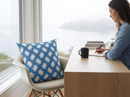 Modern Blue Geometric Tile square throw pillow in its unique interior setting