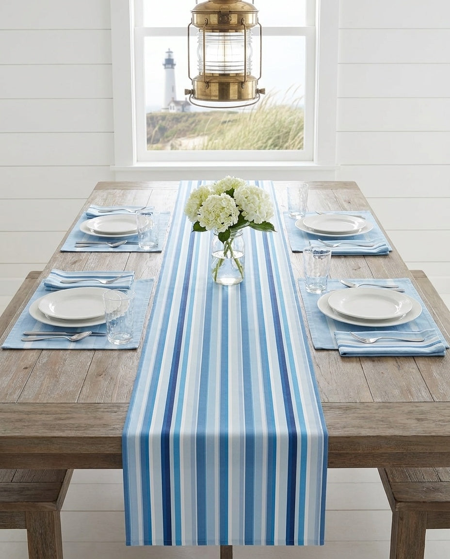 Shades of Light Blue Stripes table runner styled straight-on with matching placemats and napkins