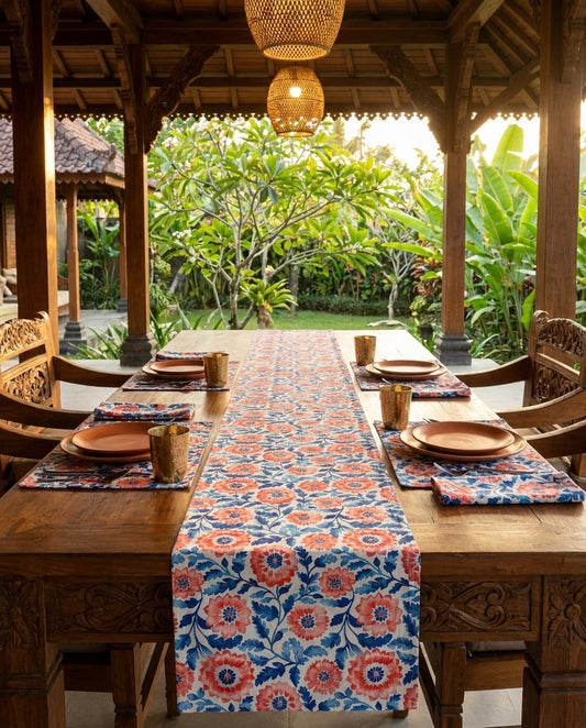 Whimsical Batik Blossoms table runner styled straight-on with matching placemats and napkins