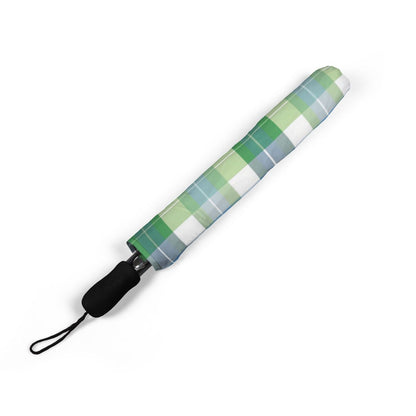 Spring Zest Plaid umbrella folded closed, showing the printed canopy and wrist strap
